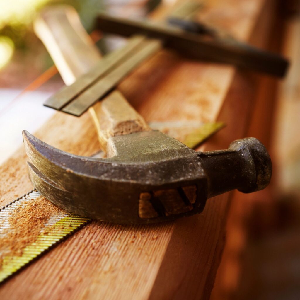 Construction Tools on a Wooden Beam